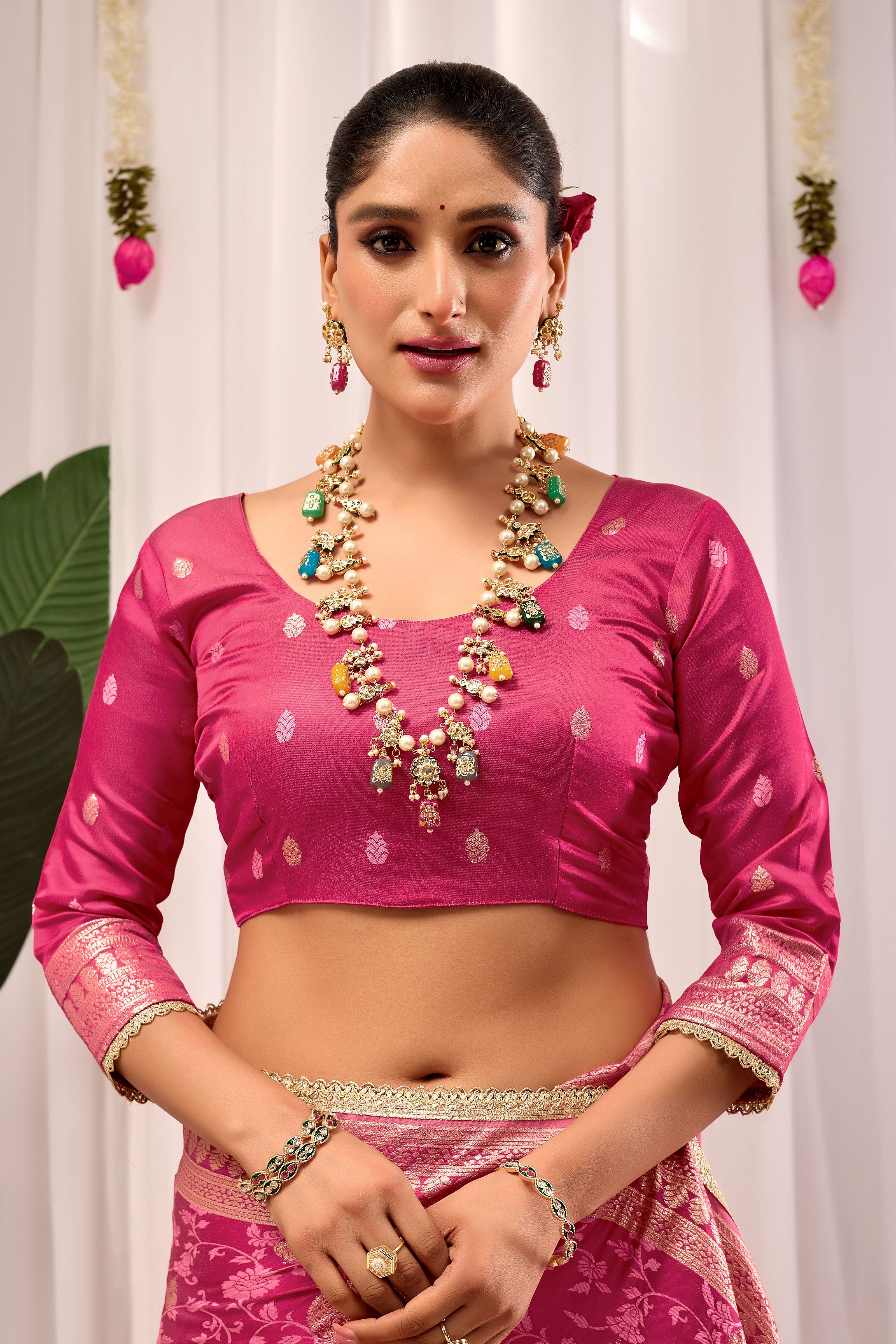 Elegant Rose Pink Floral Saree Featuring Traditional Motifs and Rich Zari Border for Festive Occasions