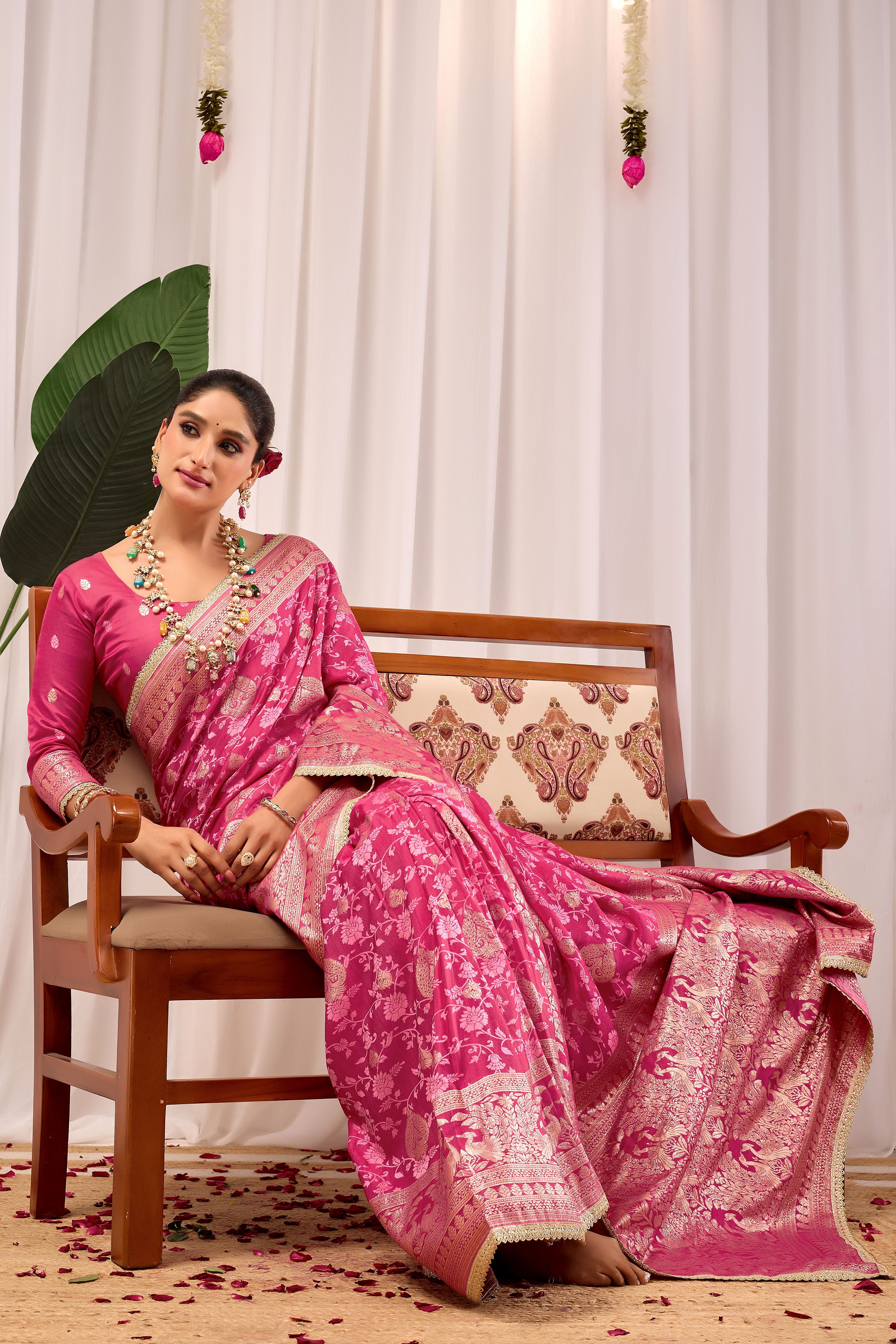 Elegant Rose Pink Floral Saree Featuring Traditional Motifs and Rich Zari Border for Festive Occasions