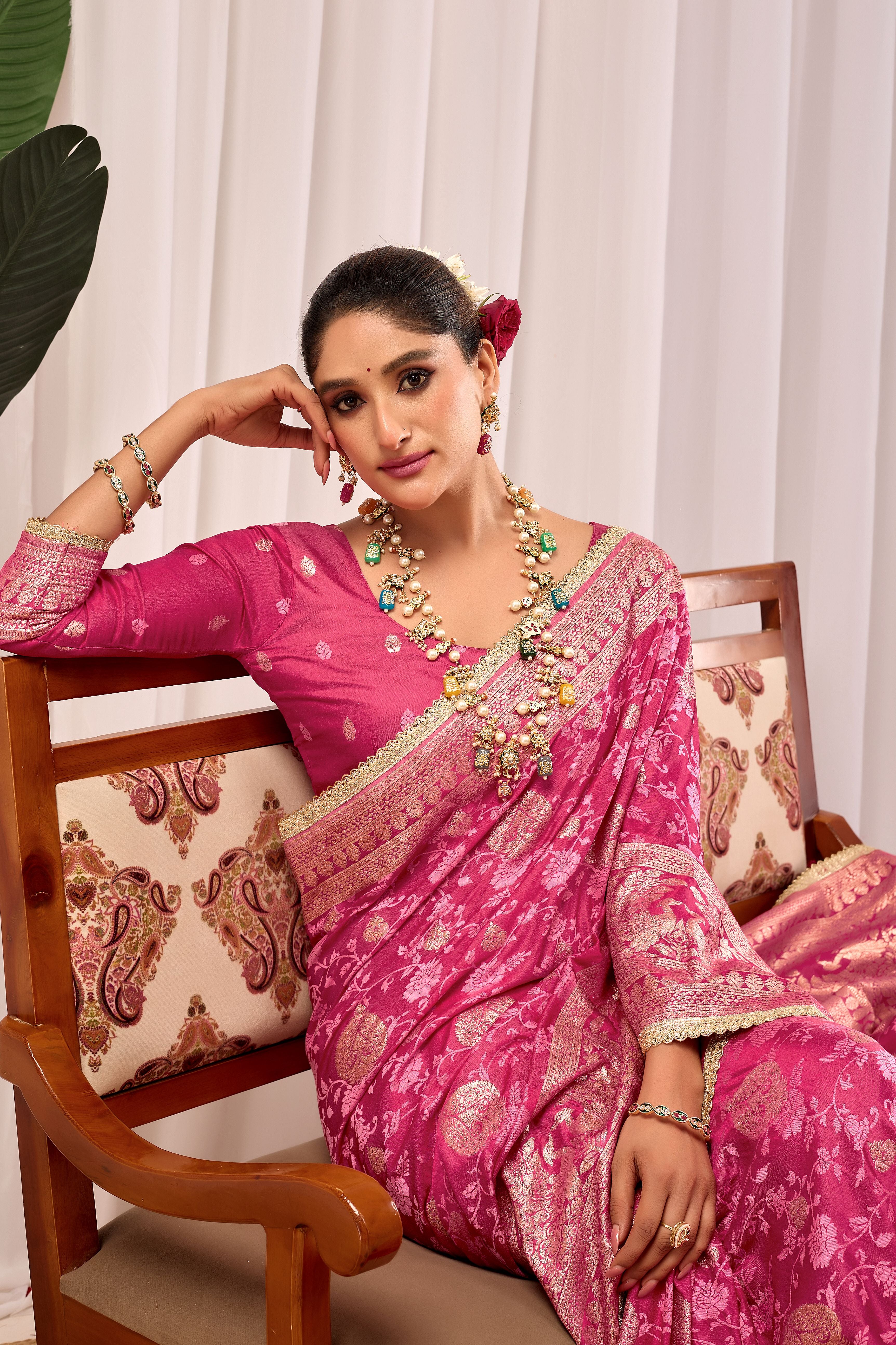 Elegant Rose Pink Floral Saree Featuring Traditional Motifs and Rich Zari Border for Festive Occasions