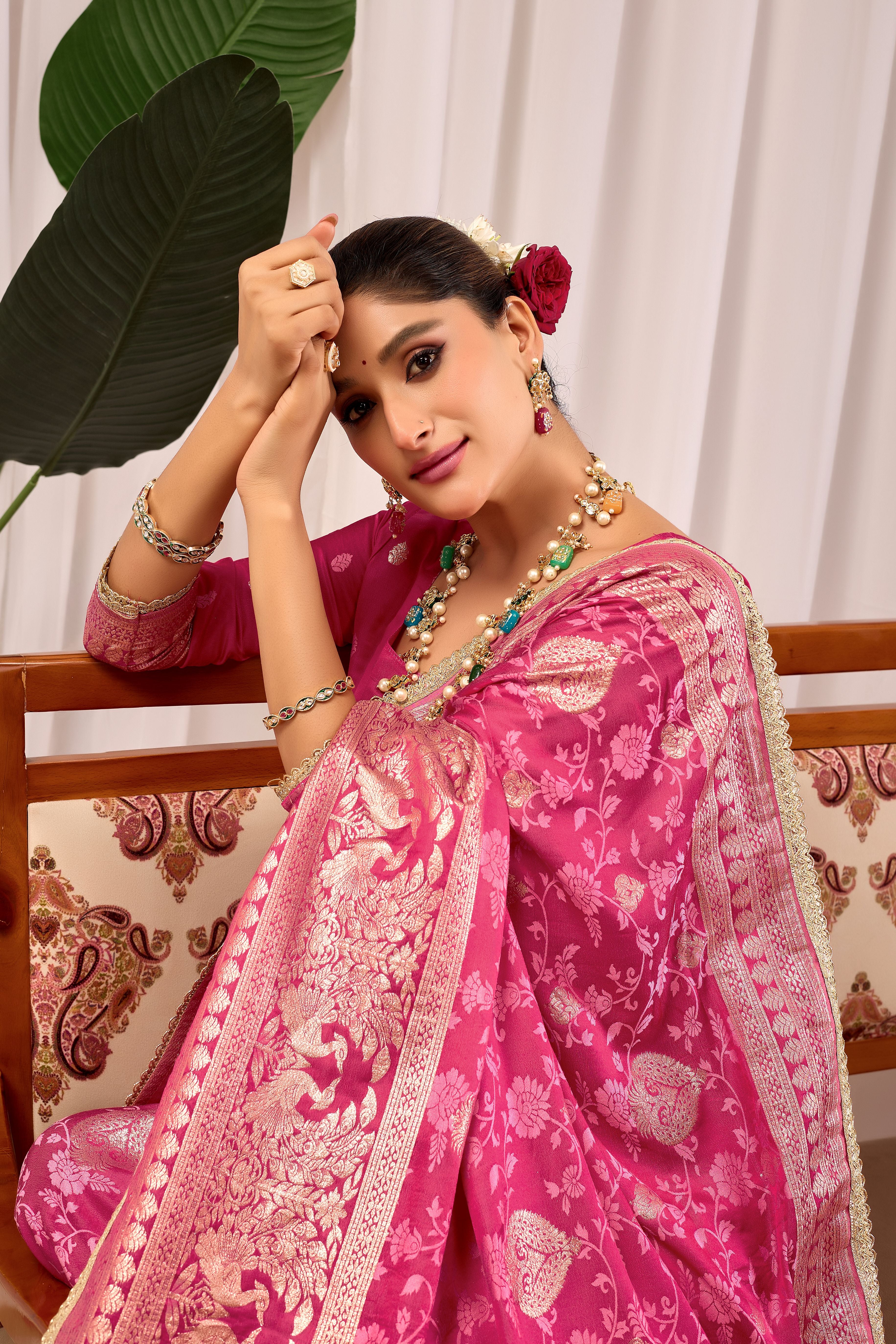 Elegant Rose Pink Floral Saree Featuring Traditional Motifs and Rich Zari Border for Festive Occasions