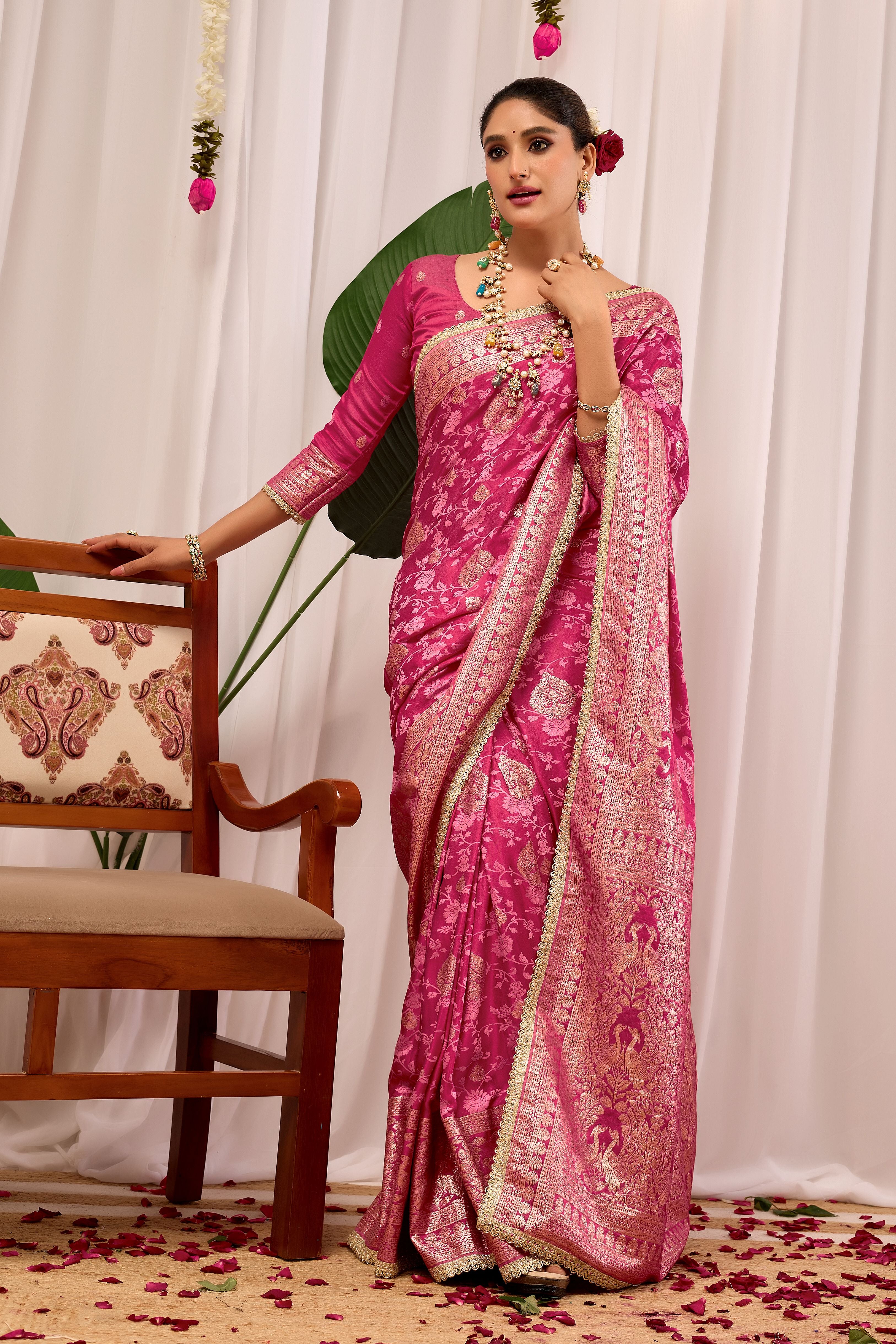 Elegant Rose Pink Floral Saree Featuring Traditional Motifs and Rich Zari Border for Festive Occasions