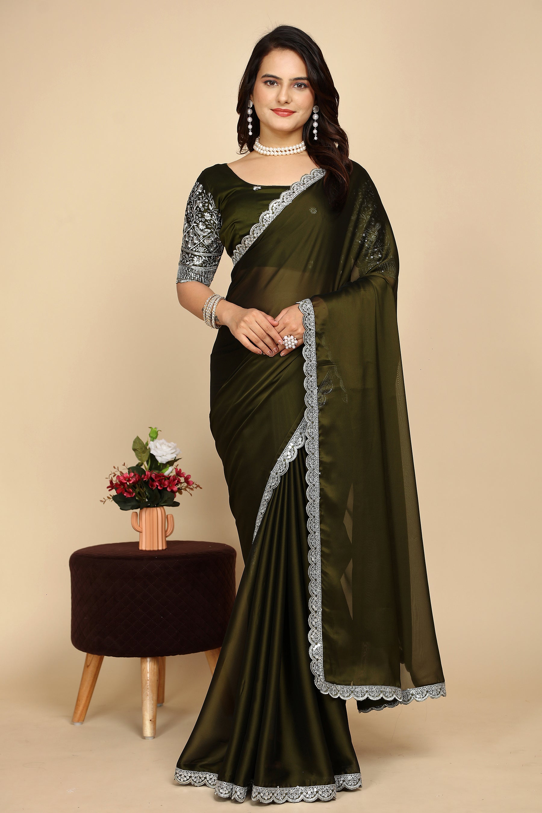 Silk Symphony: The Designer Saree That Defines Beauty in mehndi colour