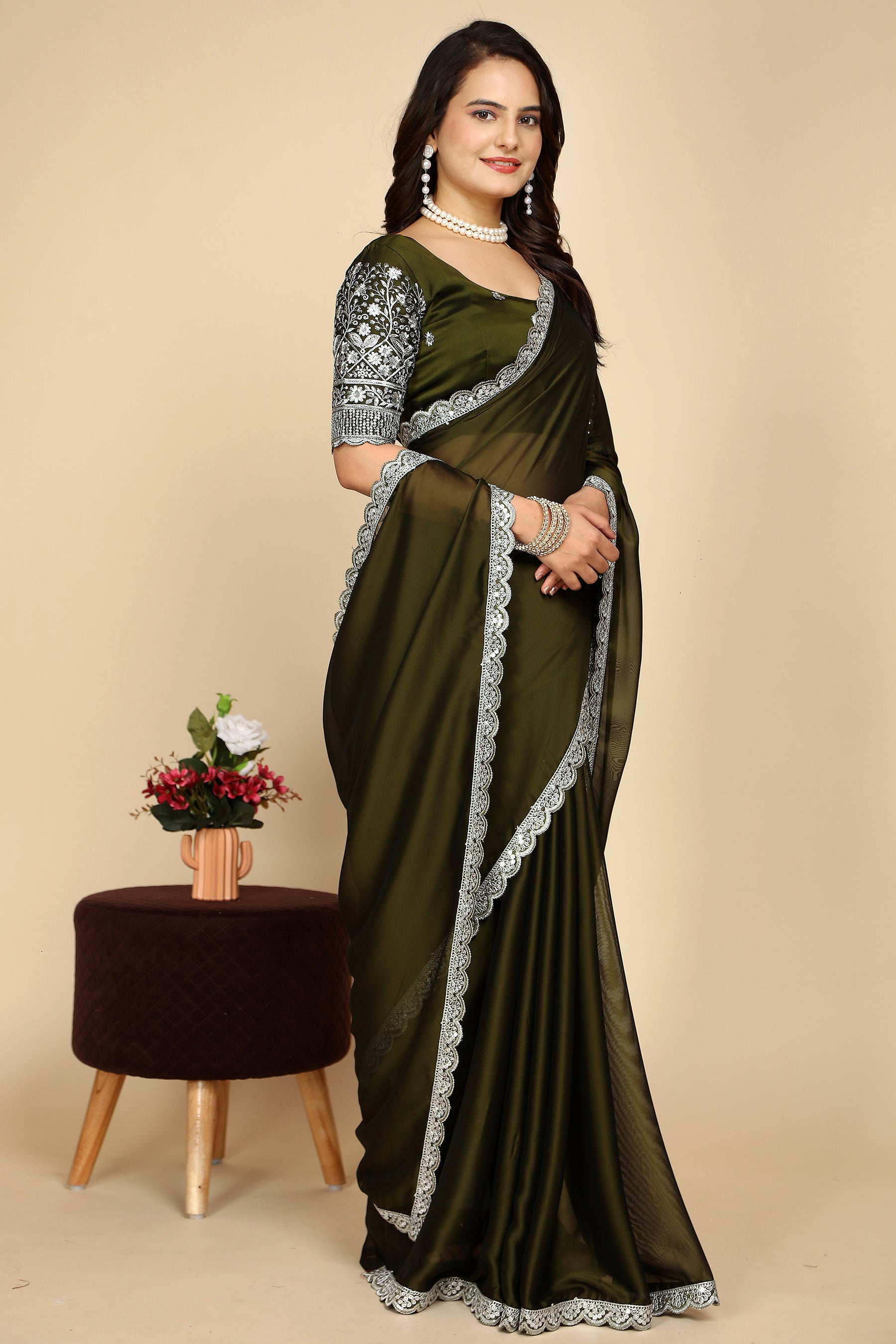 Silk Symphony: The Designer Saree That Defines Beauty in mehndi colour