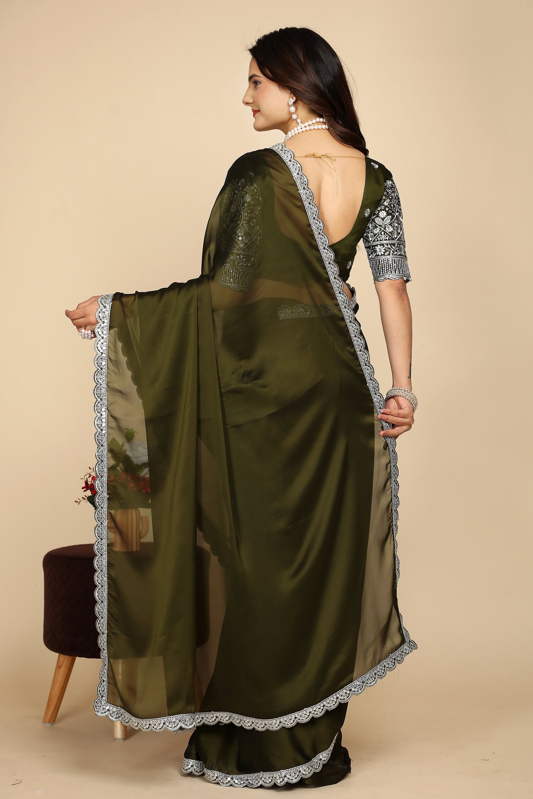 Silk Symphony: The Designer Saree That Defines Beauty in mehndi colour